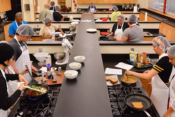 Nutrition students in groups in a classroom